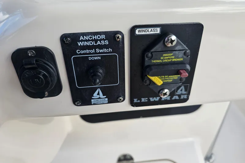 Slide: The Image of Control panel of a 2003 Grady-White Bimini 306 boat with anchor windlass switch. - 29