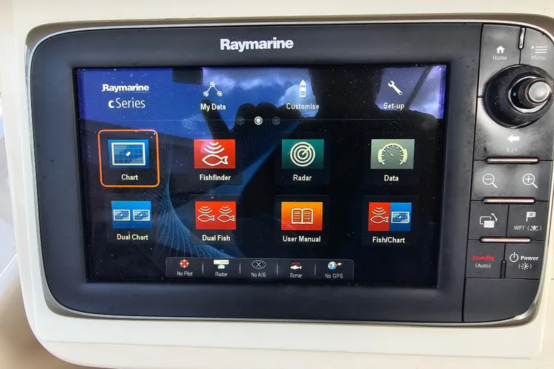 Slide: The Image of Raymarine cSeries display on 2003 Grady-White Bimini 306 boat, showing navigation and fishfinder options. - 31