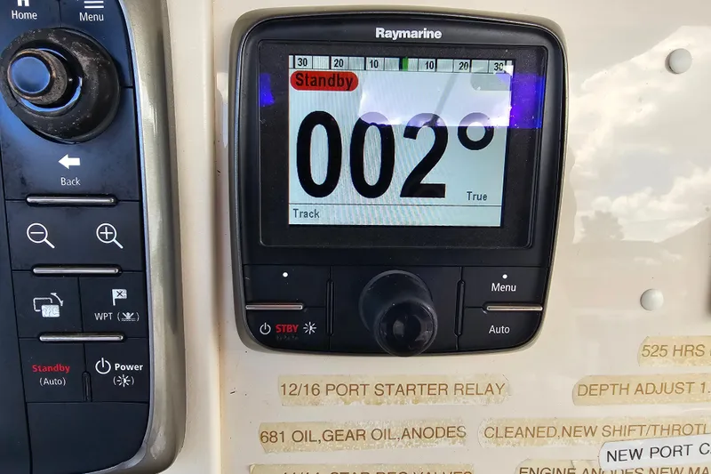 Slide: The Image of Raymarine display on 2003 Grady-White Bimini 306 showing 002° heading in standby mode. - 32