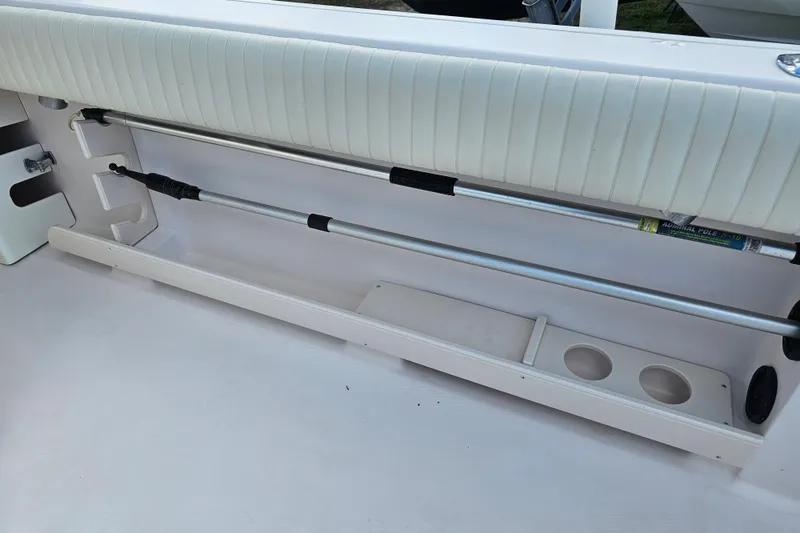 Slide: The Image of 2003 Grady-White Bimini 306 boat interior with rod holder and cup holders. - 40