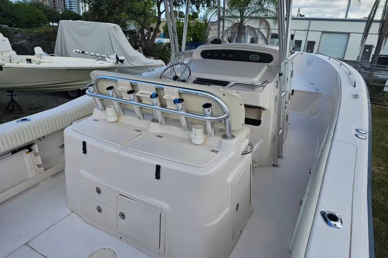 Slide: The Image of 2003 Grady-White Bimini 306 boat interior with helm and seating area. - 43