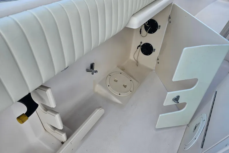 Slide: The Image of 2003 Grady-White Bimini 306 boat interior, featuring seating and storage compartments. - 46