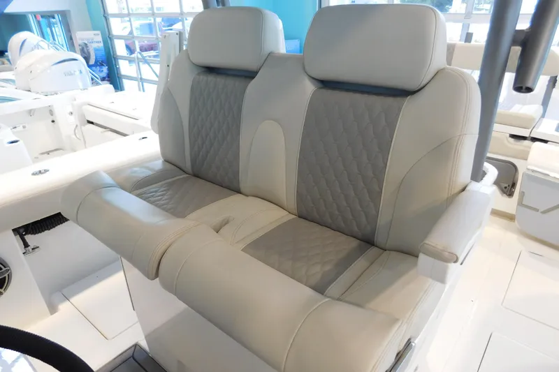 Slide: The Image of Luxurious seating on 2025 Solace 32 CS boat, featuring quilted upholstery and ergonomic design. - 10
