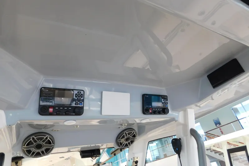 Slide: The Image of Interior view of 2025 Solace 32 CS boat with electronic controls and speakers. - 15