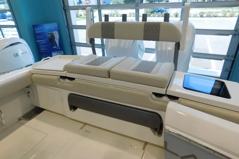 Slide: The Image of 2025 Solace 32 CS boat interior with cushioned seating and Yamaha engines. - 6