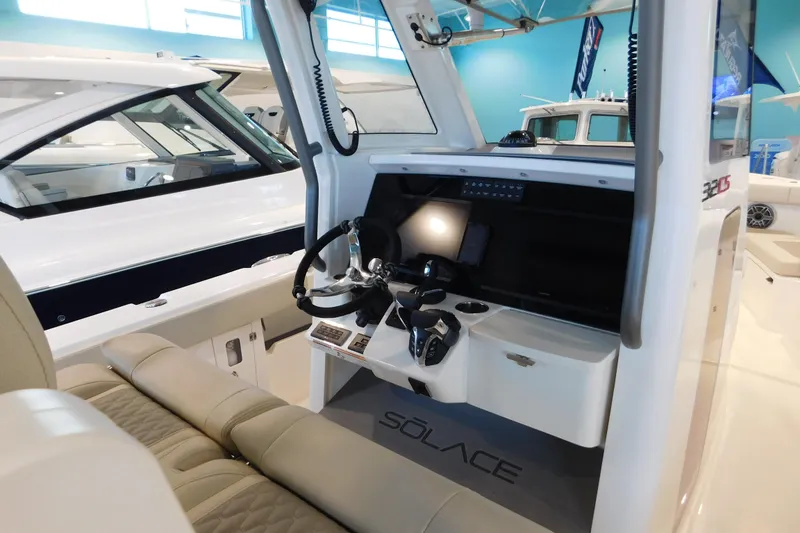 Slide: The Image of Interior view of 2025 Solace 32 CS boat cockpit with modern controls and seating. - 8