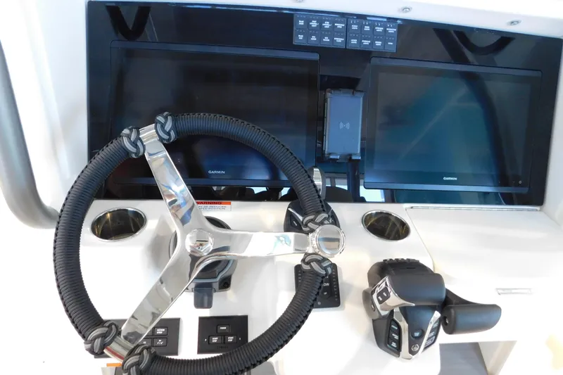 Slide: The Image of Steering console of 2025 Solace 32 CS boat with dual Garmin displays. - 9