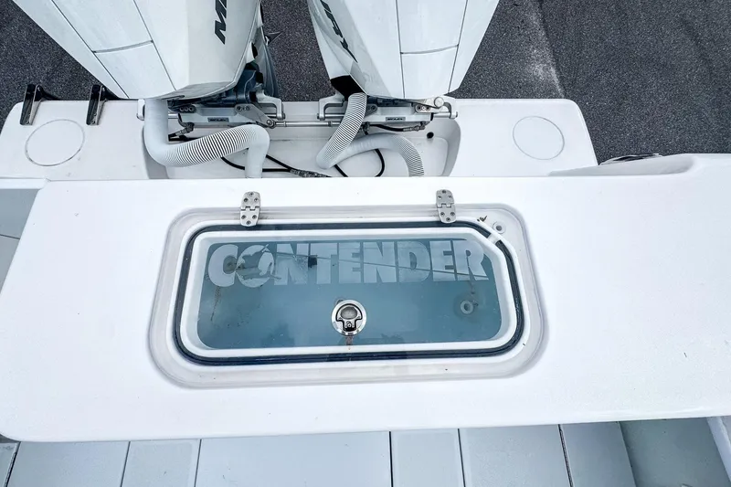 Slide: The Image of 2025 Contender 25 Tournament boat deck with dual engines and storage compartment. - 10