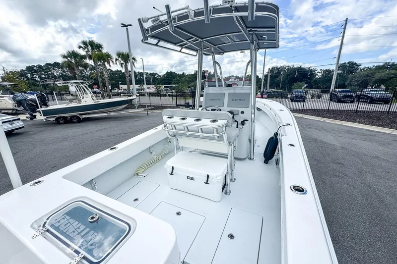 Slide: The Image of 2025 Contender 25 Tournament boat with Garmin electronics, parked outdoors under cloudy skies. - 11