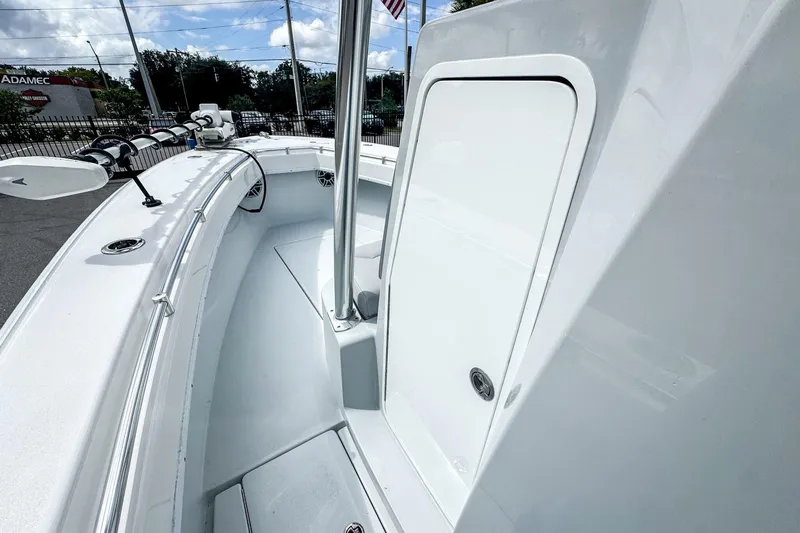 Slide: The Image of 2025 Contender 25 Tournament boat, showcasing sleek deck design and storage compartment. - 2