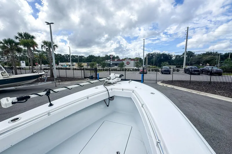 Slide: The Image of 2025 Contender 25 Tournament boat in parking lot, under cloudy sky. - 5