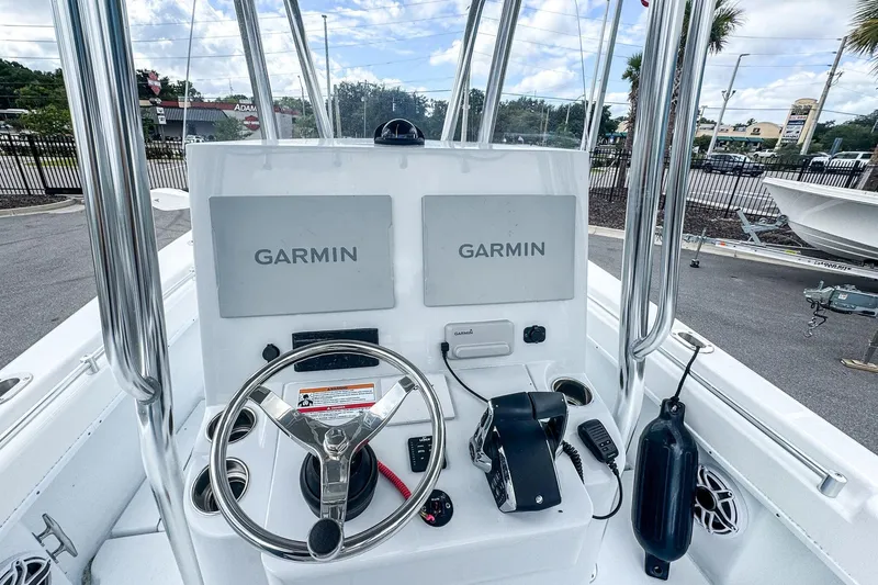 Slide: The Image of Helm of 2025 Contender 25 Tournament boat with dual Garmin displays and steering wheel. - 7
