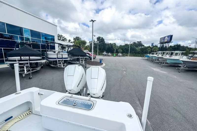 Slide: The Image of Outdoor display of 2025 Contender 25 Tournament boats at a dealership. - 9