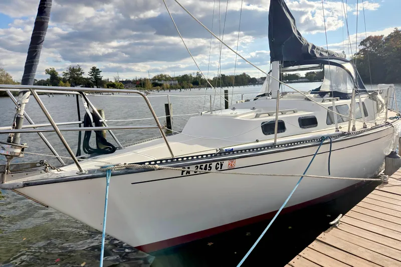The Image of 1985 S2 Yachts 9.2 C sailboat docked on a sunny day. - 0