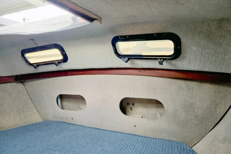 Slide: The Image of Interior of 1985 S2 Yachts 9.2 C sailboat cabin with windows and fabric lining. - 13
