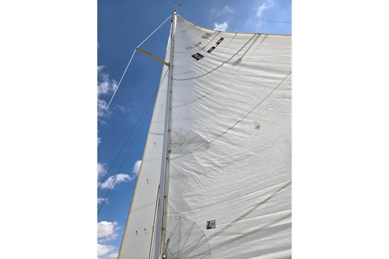 Slide: The Image of Sail of 1985 S2 Yachts 9.2 C against blue sky with clouds. - 3