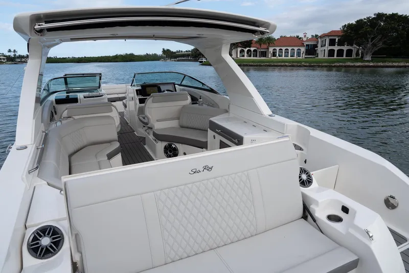 Slide: The Image of 2022 Sea Ray SLX 350 Outboard luxury boat interior on calm water. - 19