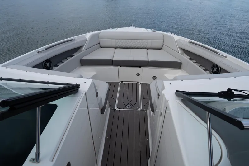 Slide: The Image of 2022 Sea Ray SLX 350 Outboard boat interior with spacious seating and elegant design. - 26
