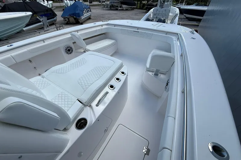 Slide: The Image of 2024 Caymas 30 CT boat interior with white seating and modern design. - 21