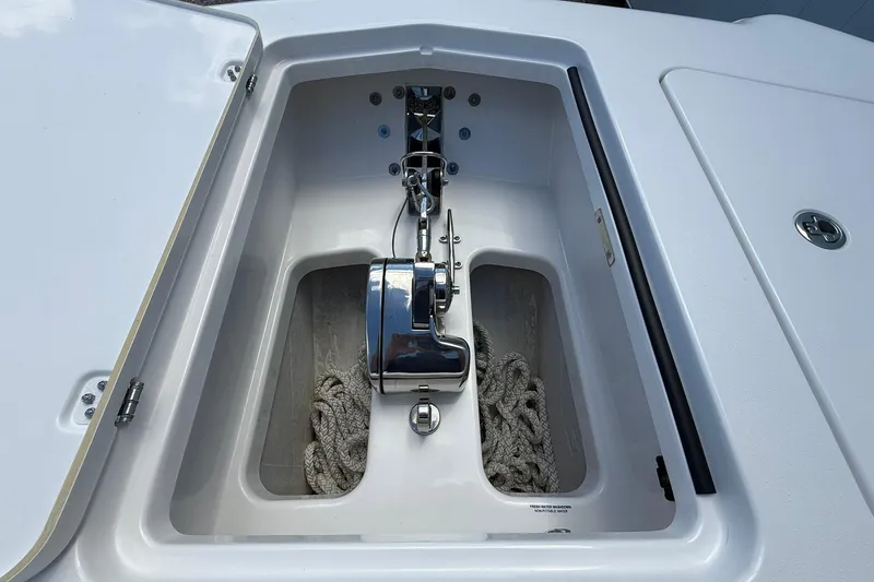 Slide: The Image of Anchor compartment of 2024 Caymas 30 CT boat with rope and winch. - 23
