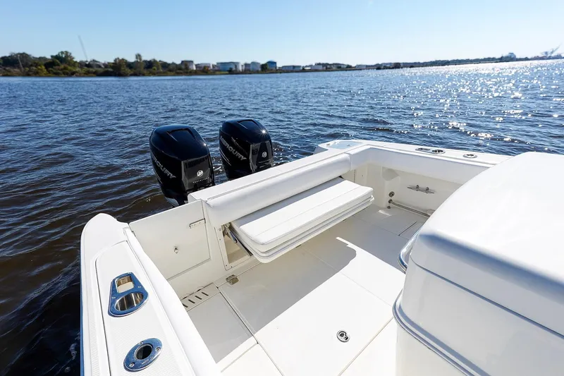 Slide: The Image of 2013 Boston Whaler 320 Outrage boat with dual Mercury engines on a sunny day. - 12