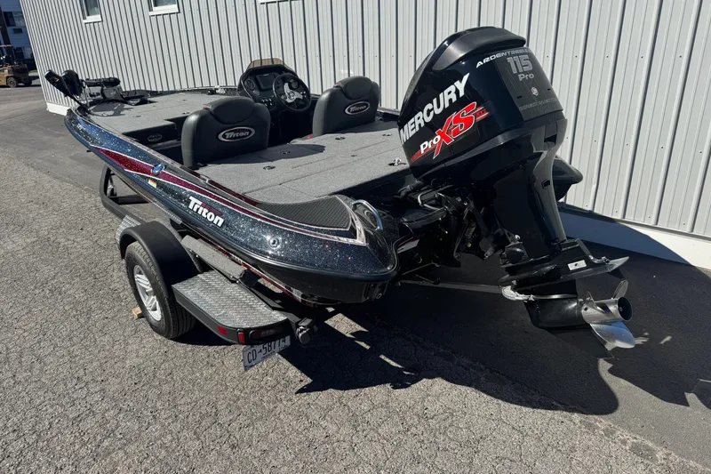 Slide: The Image of 2016 Triton 179 TrX boat with Mercury Pro XS engine on trailer. - 5