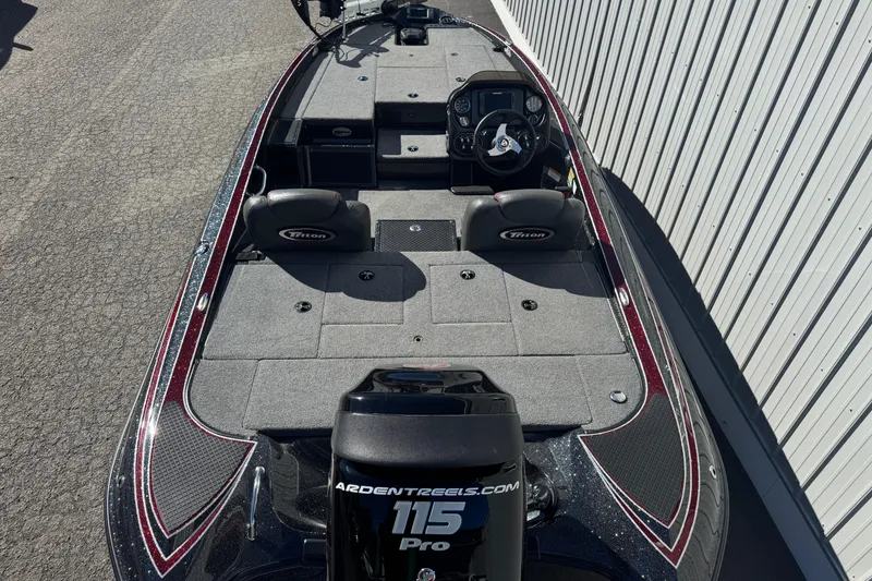 Slide: The Image of 2016 Triton 179 TrX bass boat with spacious deck and dual seating. - 6