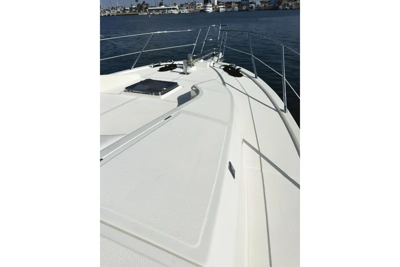 Slide: The Image of 2004 McKinna 57 PHMY Widebody yacht deck with stabilization, docked in a marina. - 10