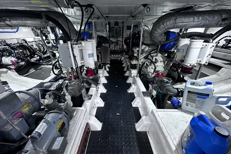 Slide: The Image of Engine room of 2004 McKinna 57 PHMY Widebody yacht, showcasing complex machinery and equipment. - 105