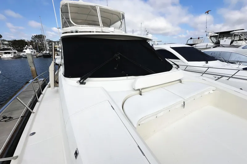 Slide: The Image of 2004 McKinna 57 PHMY Widebody yacht docked at marina, featuring stabilization. - 11