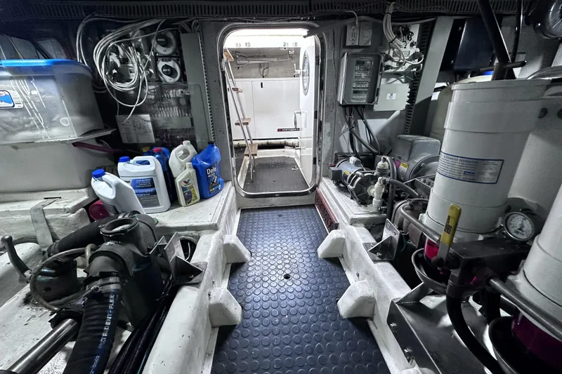 Slide: The Image of Engine room of 2004 McKinna 57 PHMY Widebody yacht, featuring equipment and supplies. - 113