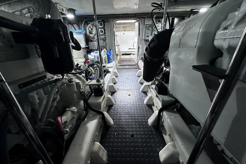 Slide: The Image of Engine room of 2004 McKinna 57 PHMY Widebody yacht, showcasing mechanical components. - 114