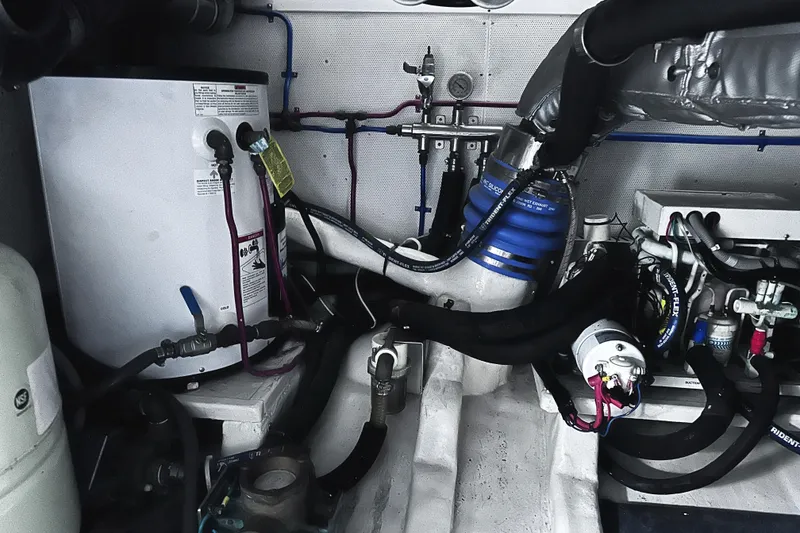 Slide: The Image of Engine room of 2004 McKinna 57 PHMY Widebody yacht, showcasing mechanical components and stabilization system. - 116