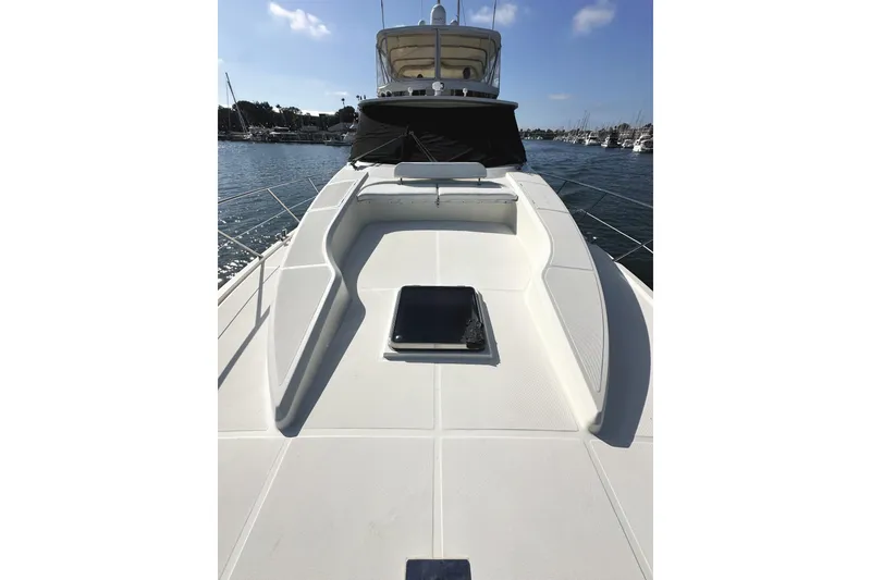 Slide: The Image of 2004 McKinna 57 PHMY Widebody yacht deck with stabilization, docked in a marina. - 13