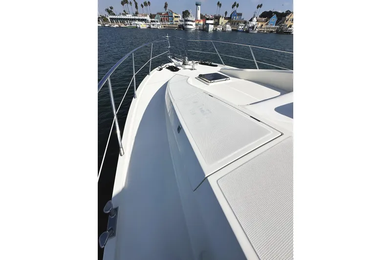 Slide: The Image of 2004 McKinna 57 PHMY Widebody yacht deck with stabilization, docked in a marina. - 15