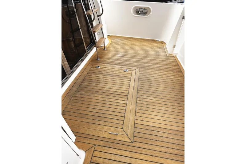 Slide: The Image of Teak deck of 2004 McKinna 57 PHMY Widebody yacht with stabilization features. - 22
