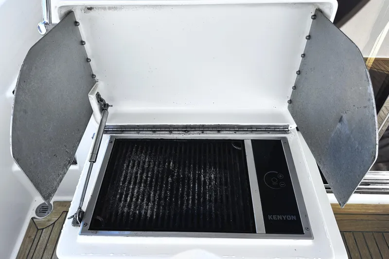 Slide: The Image of Outdoor grill on 2004 McKinna 57 PHMY Widebody yacht, featuring Kenyon cooking surface. - 26