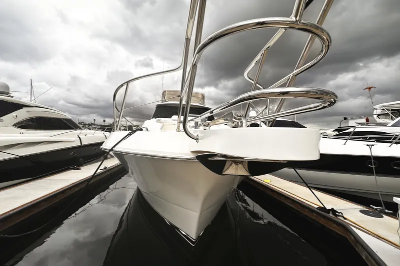 Slide: The Image of 2004 McKinna 57 PHMY Widebody yacht docked under cloudy skies. - 28