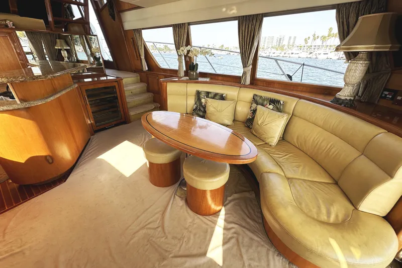 Slide: The Image of Luxurious interior of 2004 McKinna 57 PHMY yacht with elegant seating and scenic window views. - 32