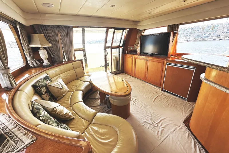 Slide: The Image of Luxurious interior of 2004 McKinna 57 PHMY yacht with leather seating and large windows. - 35