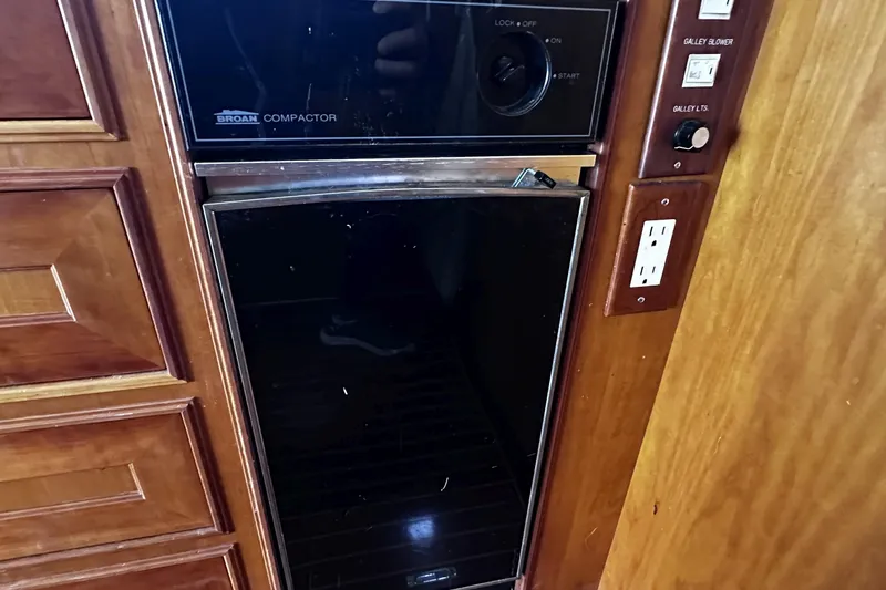 Slide: The Image of Built-in Broan compactor in 2004 McKinna 57 PHMY yacht galley. - 40