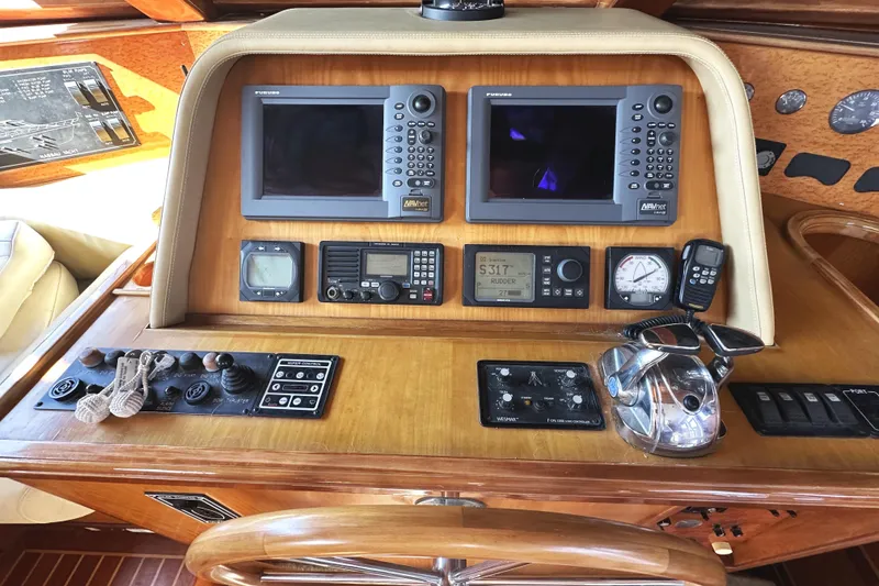 Slide: The Image of Control panel of a 2004 McKinna 57 PHMY Widebody yacht with navigation equipment. - 50