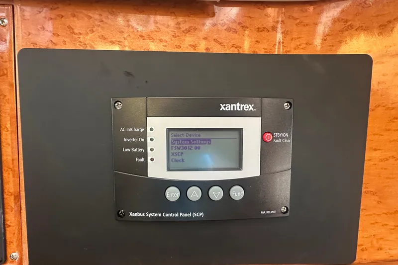 Slide: The Image of Xantrex control panel on 2004 McKinna 57 PHMY Widebody yacht, displaying system settings. - 55