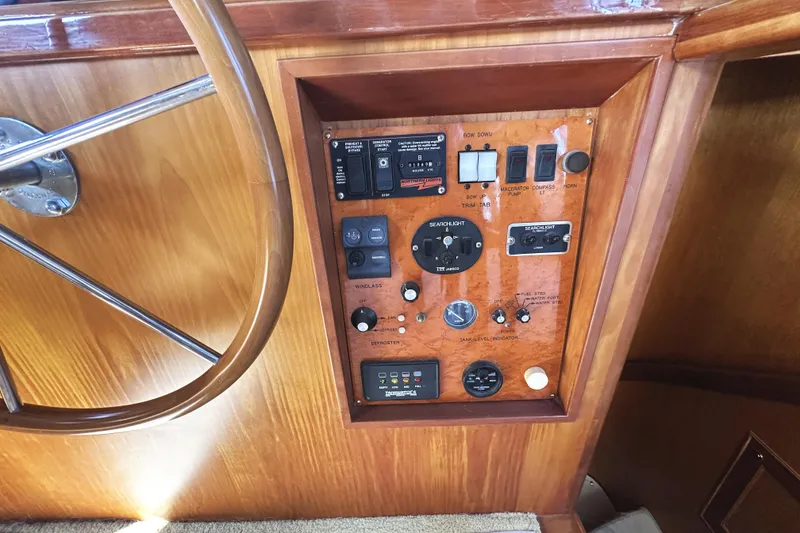 Slide: The Image of Control panel of 2004 McKinna 57 PHMY Widebody yacht with steering wheel. - 59