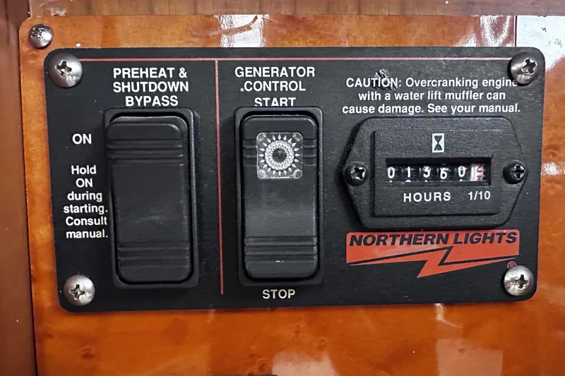 Slide: The Image of Control panel of a 2004 McKinna 57 PHMY yacht with generator start and hour meter. - 61