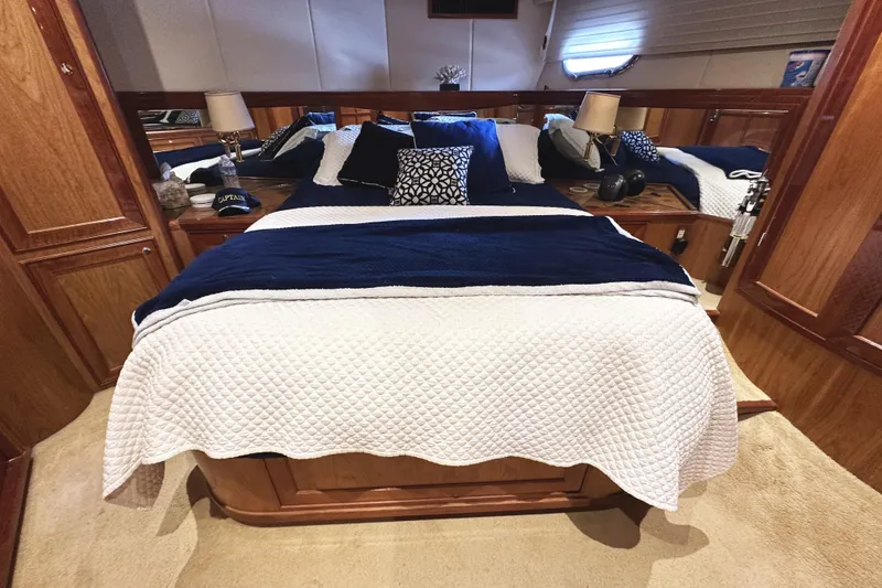 Slide: The Image of Luxurious bedroom interior of 2004 McKinna 57 PHMY yacht with elegant bedding and wood accents. - 74