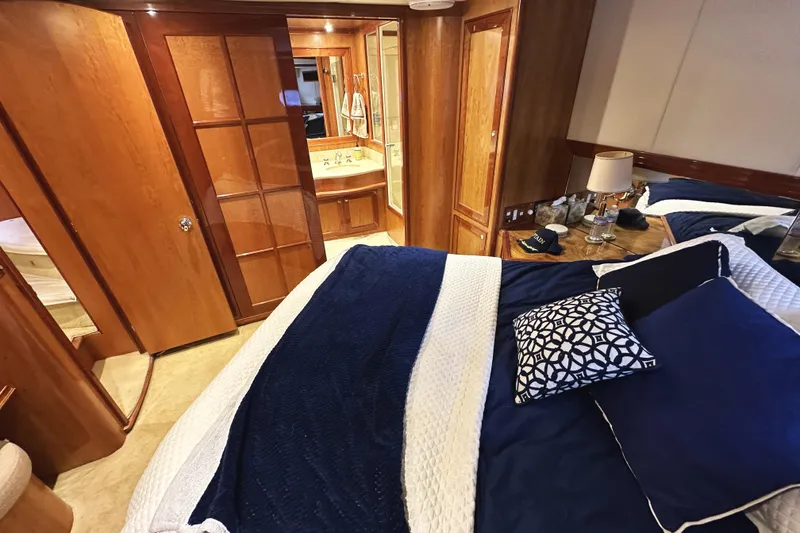 Slide: The Image of Luxurious bedroom interior of 2004 McKinna 57 PHMY yacht with elegant wood finishes. - 77
