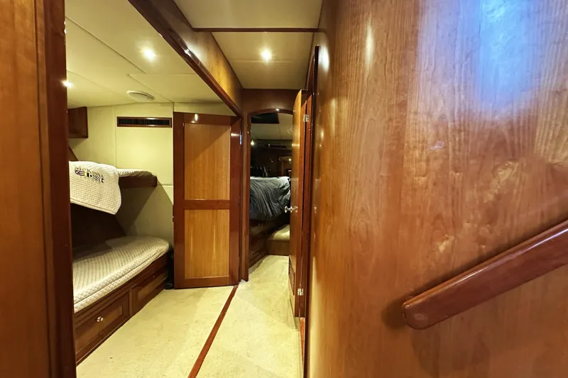 Slide: The Image of Interior of 2004 McKinna 57 PHMY yacht with wooden finishes and cozy sleeping area. - 80
