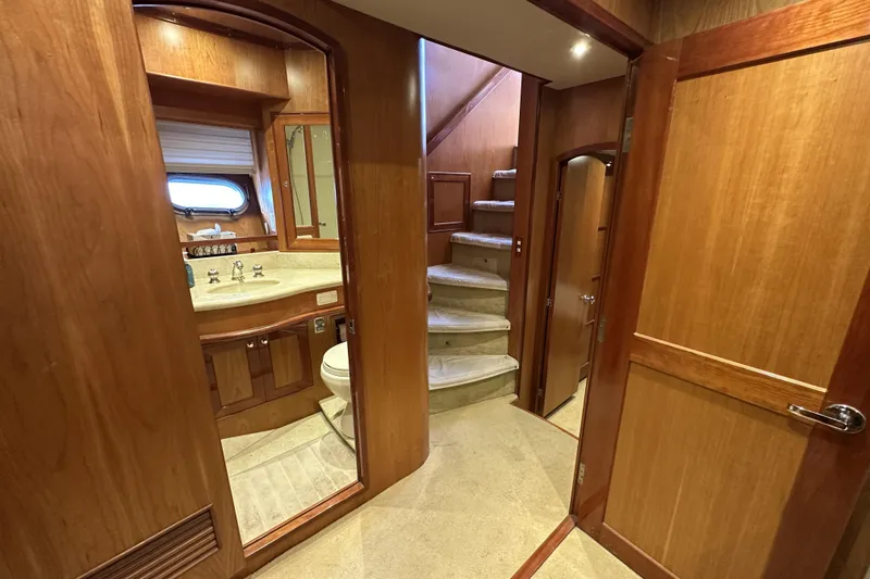 Slide: The Image of Interior of 2004 McKinna 57 PHMY yacht with wooden finishes and staircase. - 84