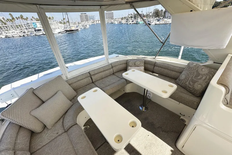 Slide: The Image of Luxurious seating area on 2004 McKinna 57 PHMY yacht, overlooking marina. - 93